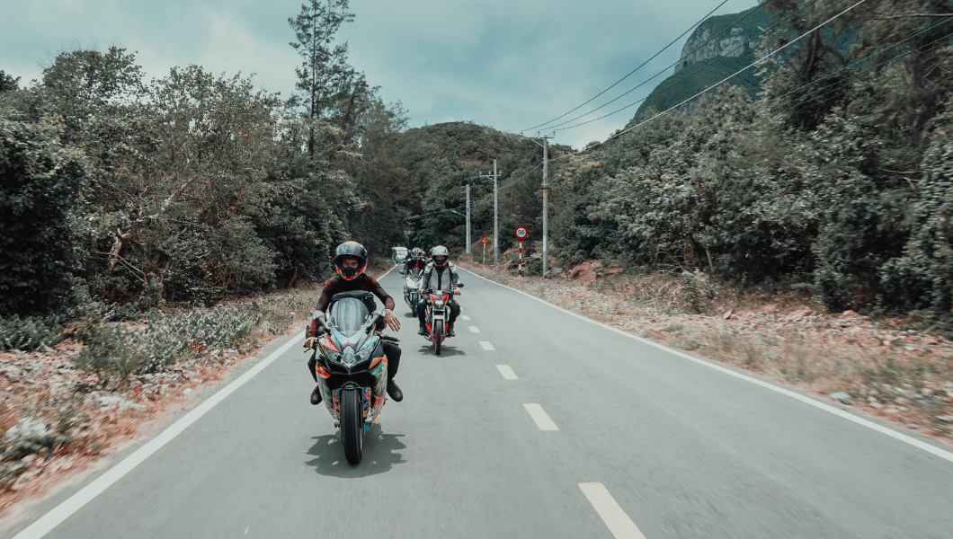 People on motorbike on big road in Bangkok